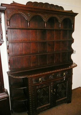 Lot 521 - Large carved oak dresser and rack