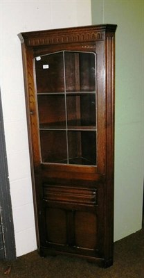 Lot 523 - Reproduction oak corner cabinet