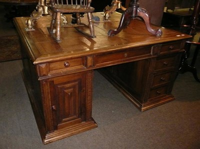 Lot 555 - Large oak partners desk with leather insert