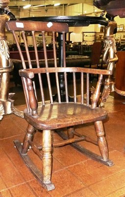 Lot 557 - 19th century child's stick back rocking chair