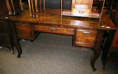 Lot 561 - Oak three drawer hall table