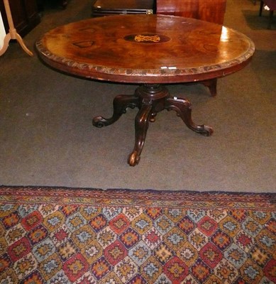 Lot 566 - A machine woven Persian style runner and a Victorian walnut oval table with inlaid decoration