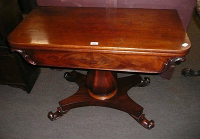 Lot 567 - Victorian mahogany fold over tea table on pedestal base