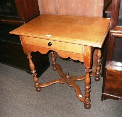 Lot 569 - Oak side table on stretcher base