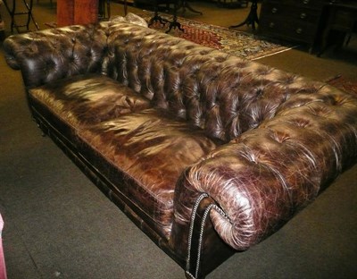 Lot 581 - A large modern brown leather Chesterfield sofa by Halo Living