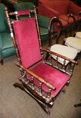 Lot 584 - Upholstered American rocking chair