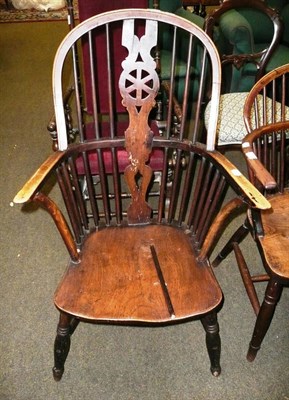 Lot 586 - A 19th century Windsor arm chair with crinoline stretcher