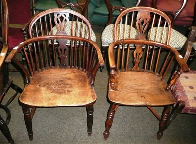 Lot 587 - An yew and ash Windsor arm chair with crinoline stretcher and another similar