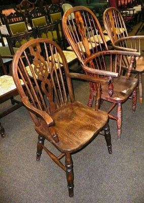 Lot 597 - Wheel back carver chair and two other Windsor chairs (3)