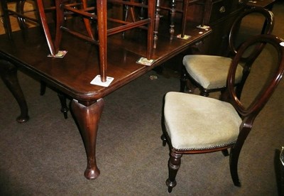 Lot 628 - Set of four Victorian mahogany balloon back chairs and a Victorian mahogany wind-out table