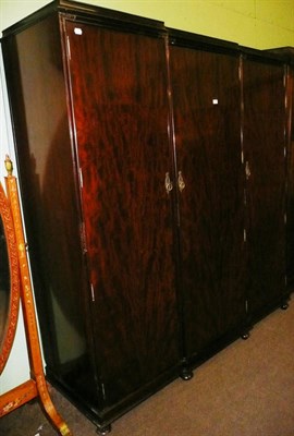 Lot 644 - Mahogany triple wardrobe