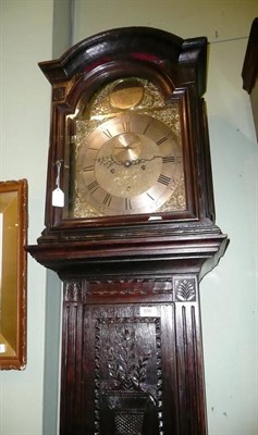 Lot 656 - A carved oak cased eight day longcase clock with brass arch dial by Knowles Epsom, no pendulum