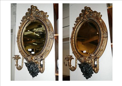 Lot 662 - Pair of reproduction gilt oval mirrors