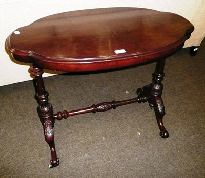 Lot 605A - An oval occasional table