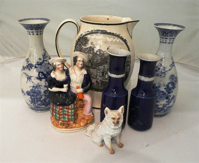 Lot 16 - A large 19th century creamware jug 'The Farmers Arms' (spout a.f.) a Staffordshire group and a pair