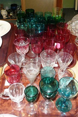 Lot 31 - A quantity of coloured wine glasses etc (approximately 39) on two trays