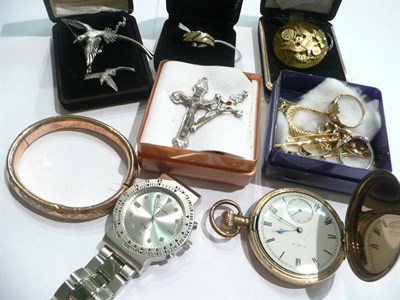 Lot 40 - A gents ring stamped '18K', gold earrings, a silver dress ring, crucifixes, a pocket watch...