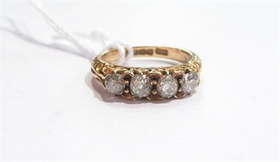 Lot 44 - A diamond four stone ring (cased)