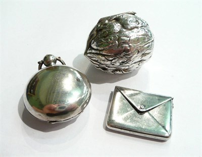 Lot 47 - A silver walnut-shaped box, a silver envelope stamp case and a sovereign case