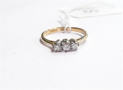 Lot 59 - A diamond three stone ring