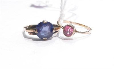 Lot 83 - A blue sapphire ring (stone scuffed) and a pink coloured spinel ring