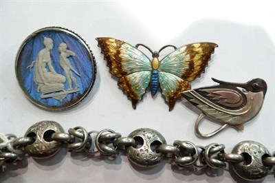 Lot 89 - A silver enamelled butterfly brooch, a bracelet, a silver brooch and another brooch