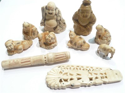 Lot 93 - Seven Japanese netsukes, a bone folding knife, miniature elephant and a bodkin case