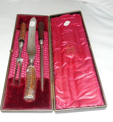 Lot 148 - A carving set, cased