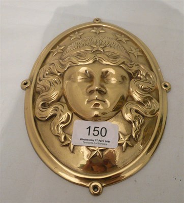 Lot 150 - A brass oval plaque