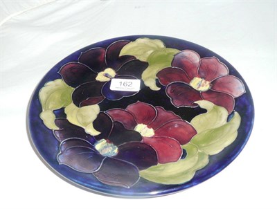 Lot 162 - A Walter Moorcroft 'Clematis' plate