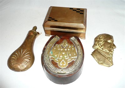 Lot 180 - Powder flask, brass games compendium, relief plaque and a cribbage board