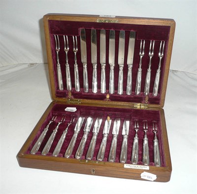 Lot 181 - Set of twelve pairs of silver desert knives and forks by 'Hamilton & Inches, Edinburgh' in an...