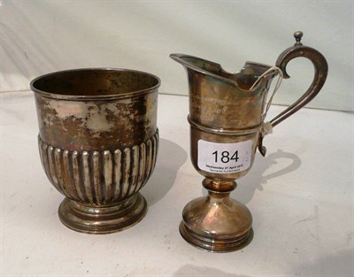 Lot 184 - A silver cream jug 8oz and a semi fluted vase stamped '800' (2)