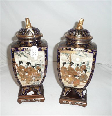 Lot 186 - Pair of Japanese blue ground vases and covers