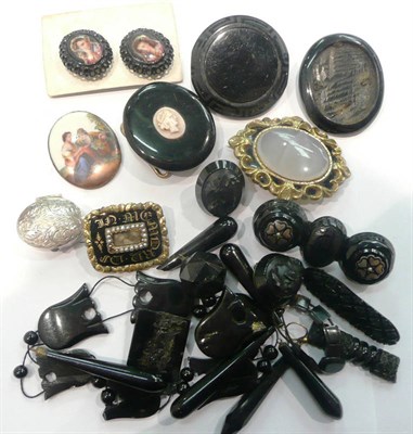 Lot 245 - A quantity of Whitby jet jewellery, three mourning brooches and a silver pill box