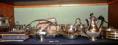 Lot 257 - A shelf of silver plated ware including tea services, salvers, flatware, toast racks etc