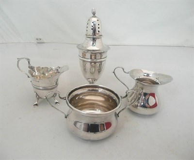 Lot 266 - A silver sugar caster, two cream jugs and a twin handled sugar bowl, 10oz