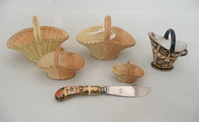 Lot 267 - Four Royal Worcester blush ivory baskets (varying sizes), Royal Crown Derby cauldron and a...