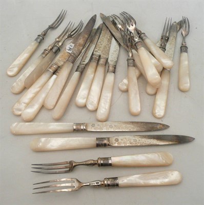 Lot 277 - Twelve silver dessert knives and eleven forks with mother of pearl handles