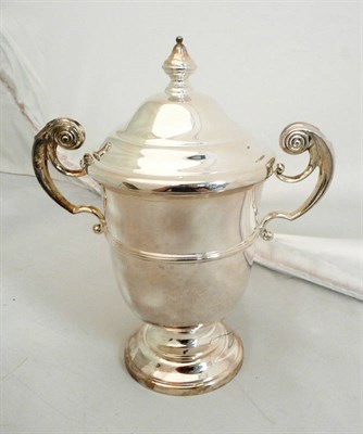 Lot 286 - A silver two handled trophy cup and cover, 21oz