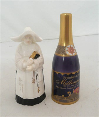 Lot 295 - A Worcester candle snuffer in the form of a Nun together with a Millennium vintage champagne bottle