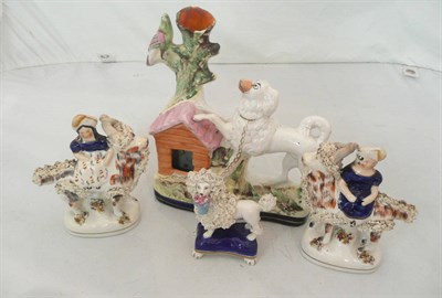 Lot 308 - Small pair of Staffordshire goats, dog and kennel and a poodle on a blue base