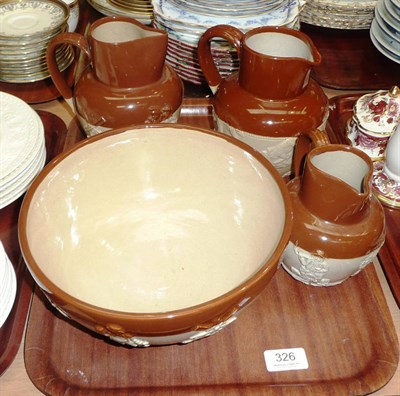 Lot 326 - Three stoneware jugs and a bowl