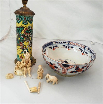 Lot 334 - A Japanese sectional ivory figure group, Chinese yellow ground sleeve vase as a lamp and a Japanese