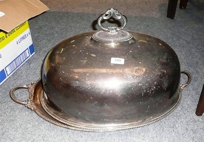 Lot 349 - Two large silver plated meat dish covers and a two handled tea tray