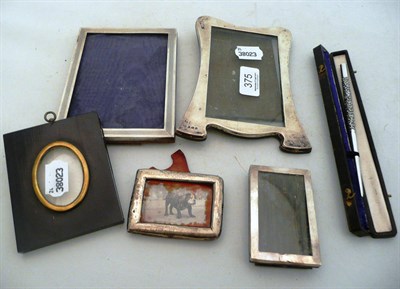 Lot 375 - Four silver photograph frames, a cased dip pen and an ebonised miniature frame