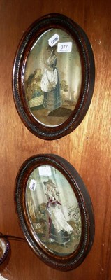 Lot 377 - A pair of Georgian embroidered silk pictures of ladies in garden settings (a.f)