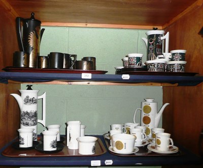 Lot 382 - Four coffee services on two shelves