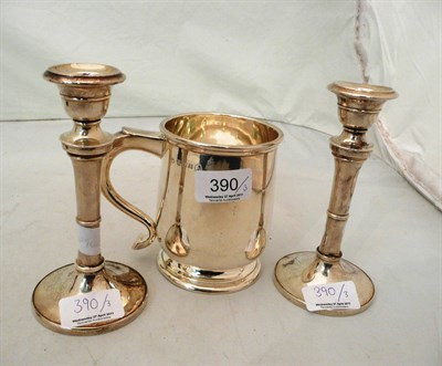 Lot 390 - A pair of silver candlesticks and a silver mug