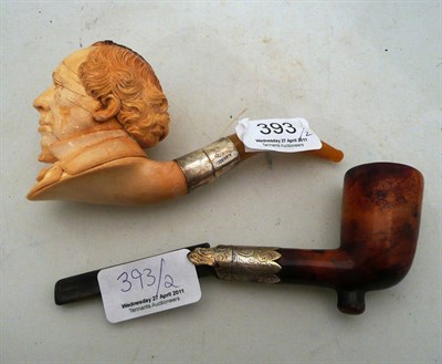 Lot 393 - Two cased pipes, one meerschaum pipe carved as Disraeli with silver mount and amber mouth...